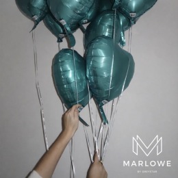 a person holding balloons