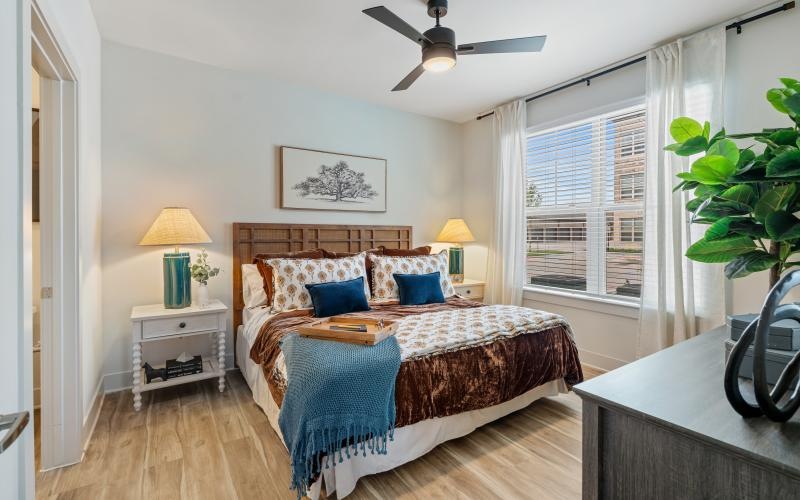 a bedroom with a bed and a table