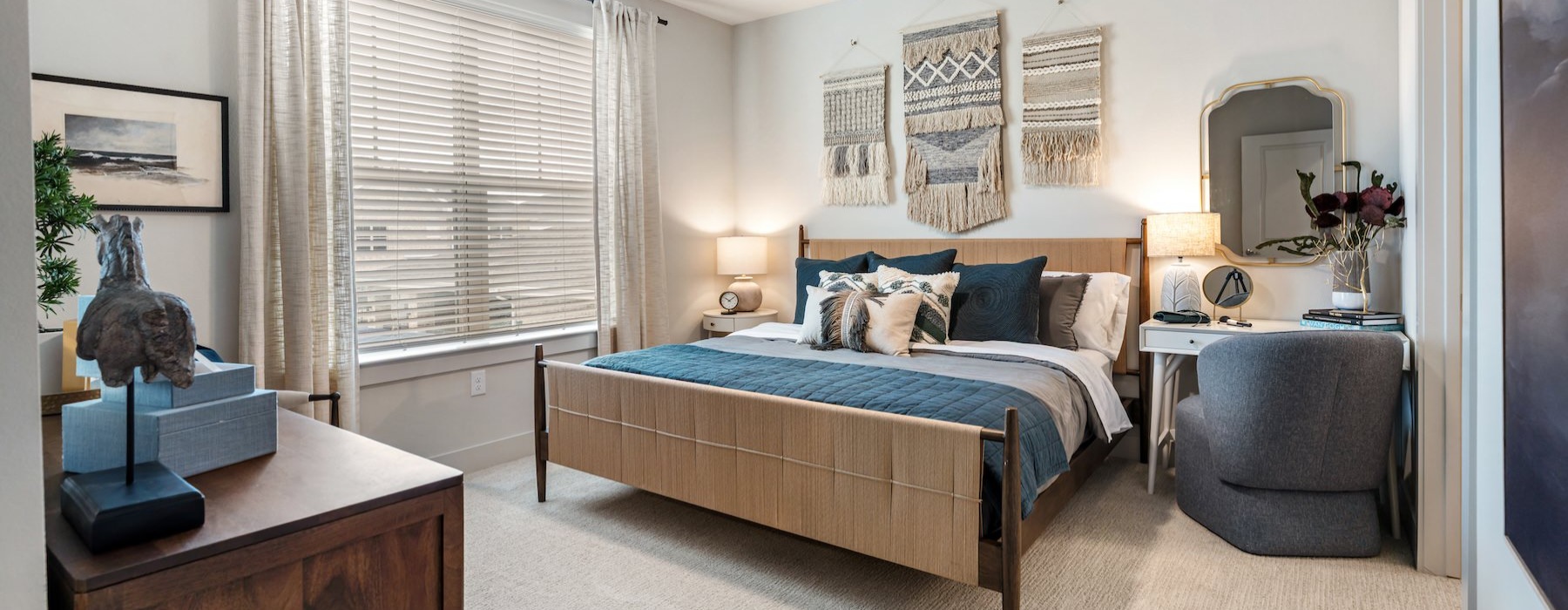 a bedroom with a bed and a chair