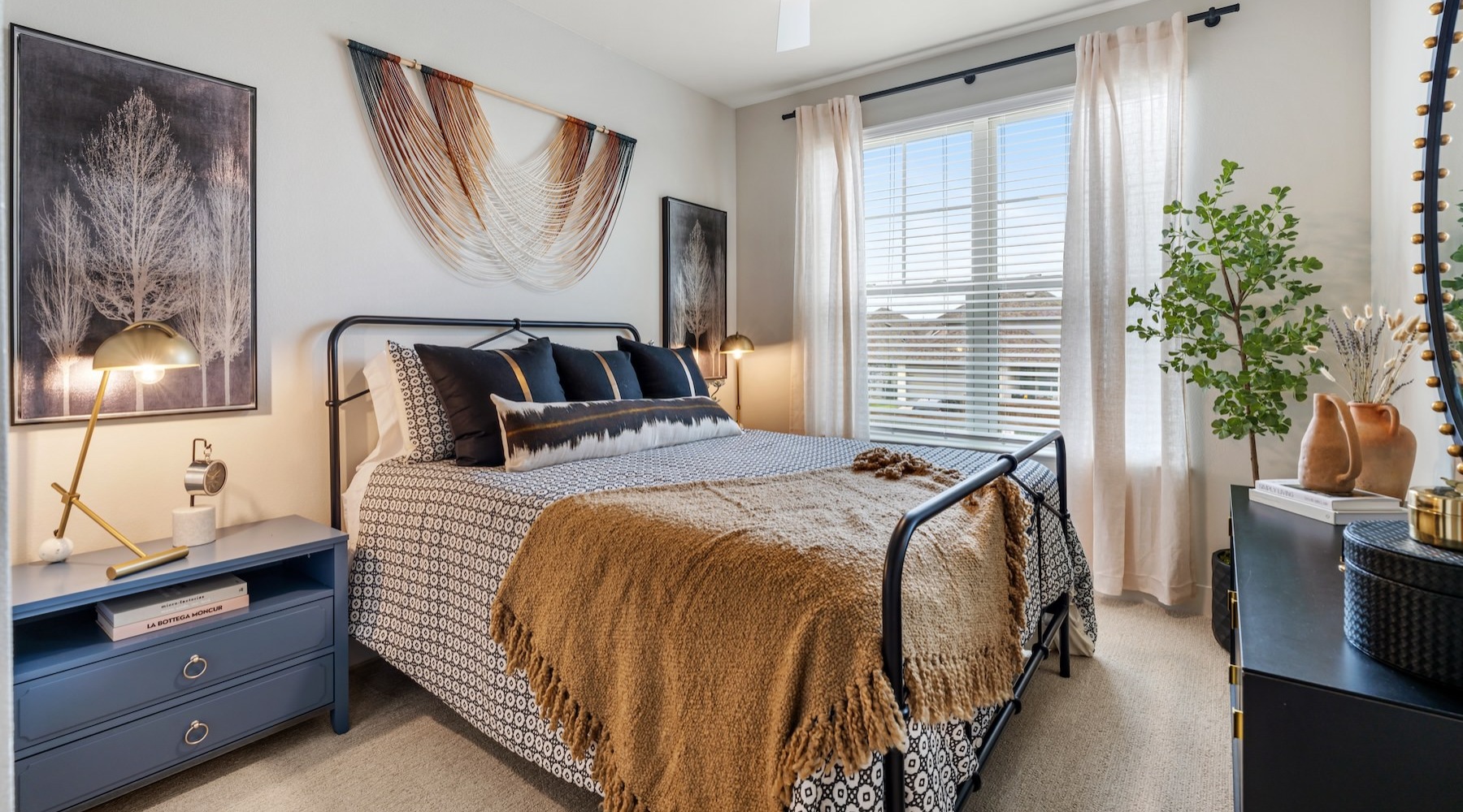 a bedroom with a bed and two nightstands