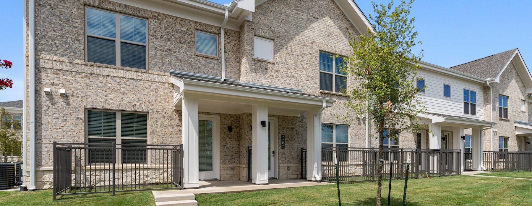 a large building with a tree in front of it