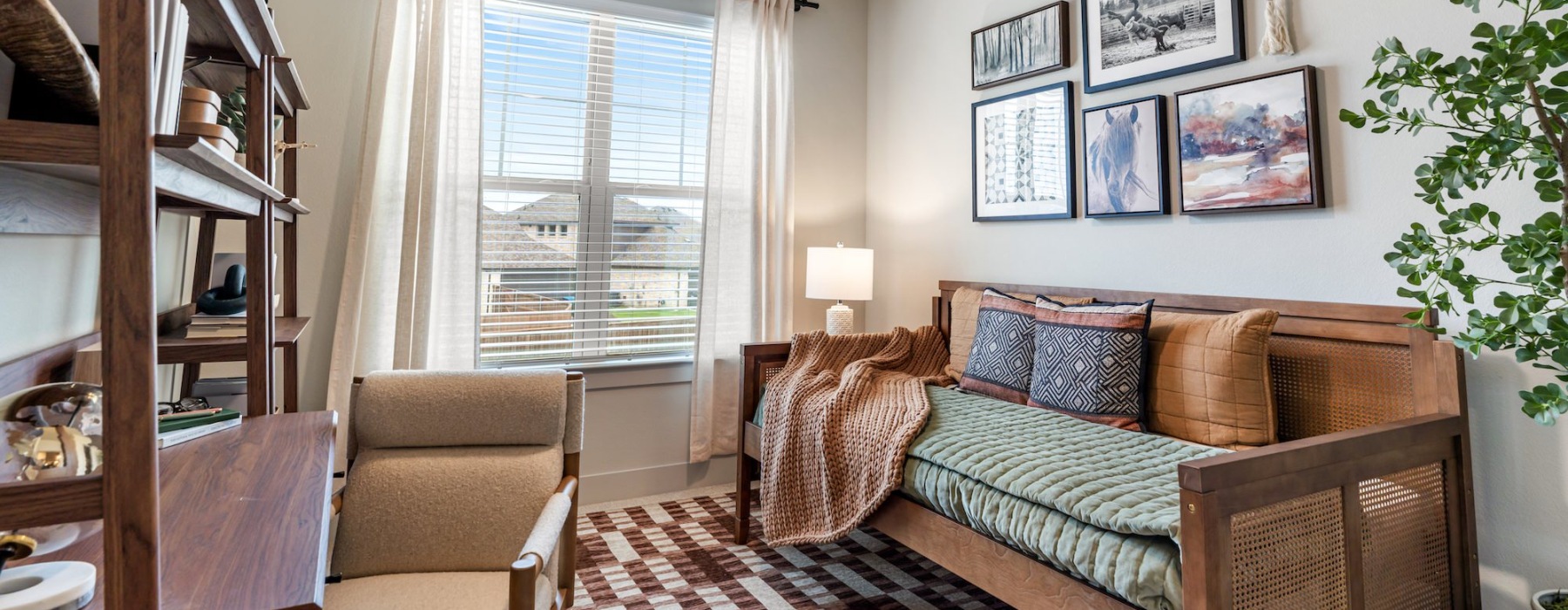 a living room with a couch, table and chair
